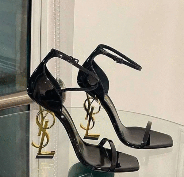 Elegant and direct YSL-style black block heels with ankle strap and pointed toe